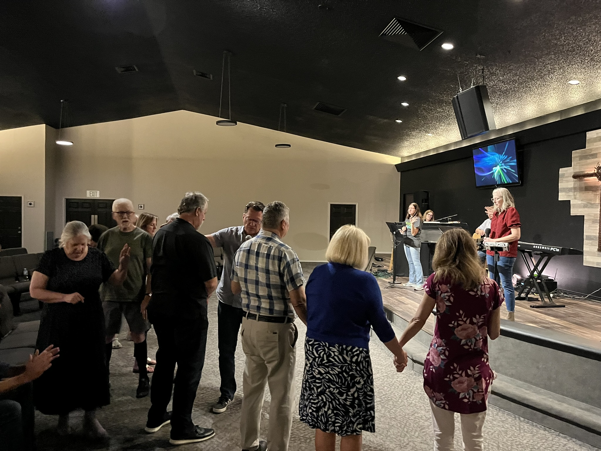 Several step out for intercessory prayer and blessing