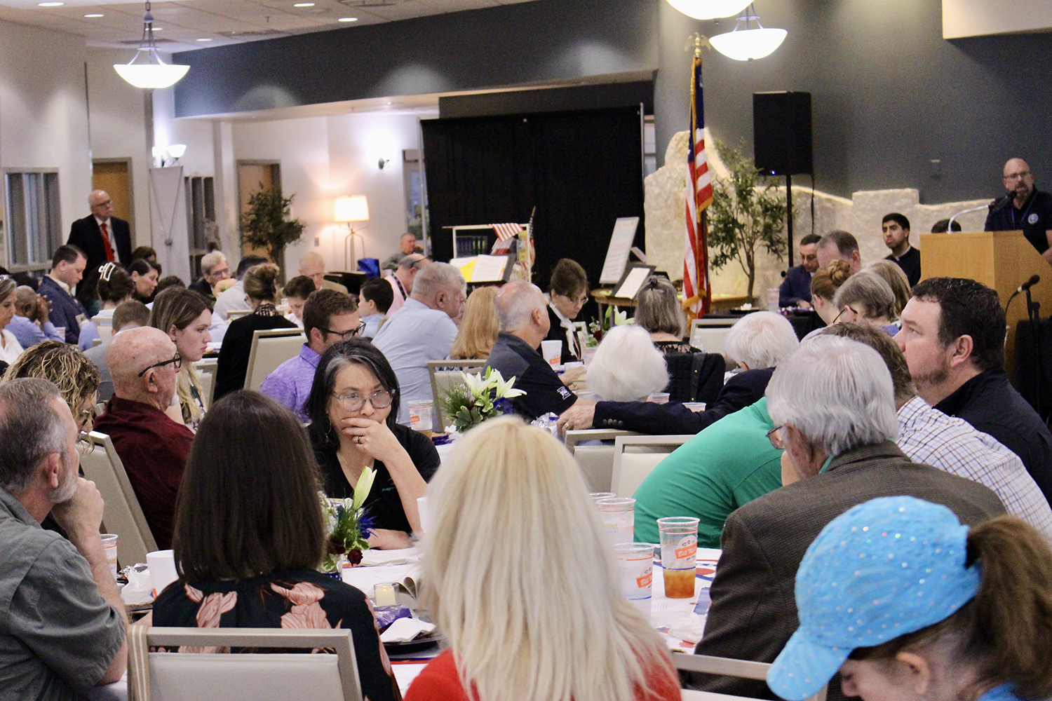 Breakfast attendees listen as Will Smith prays